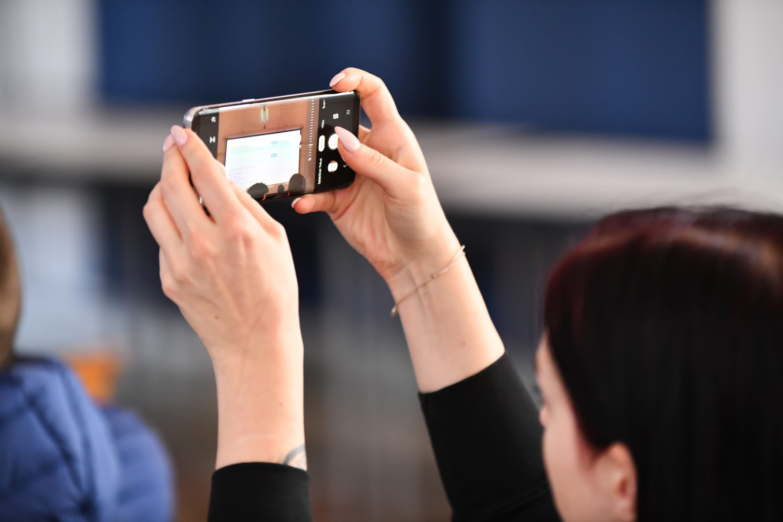 A person making a photo with a smartphone